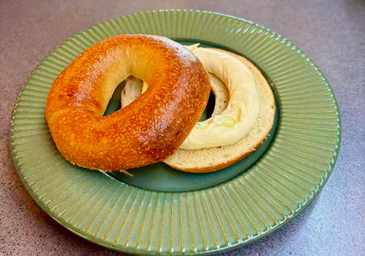 CARAMELIZED ONION BAGEL WITH SPRING ONION CREAM CHEESE
